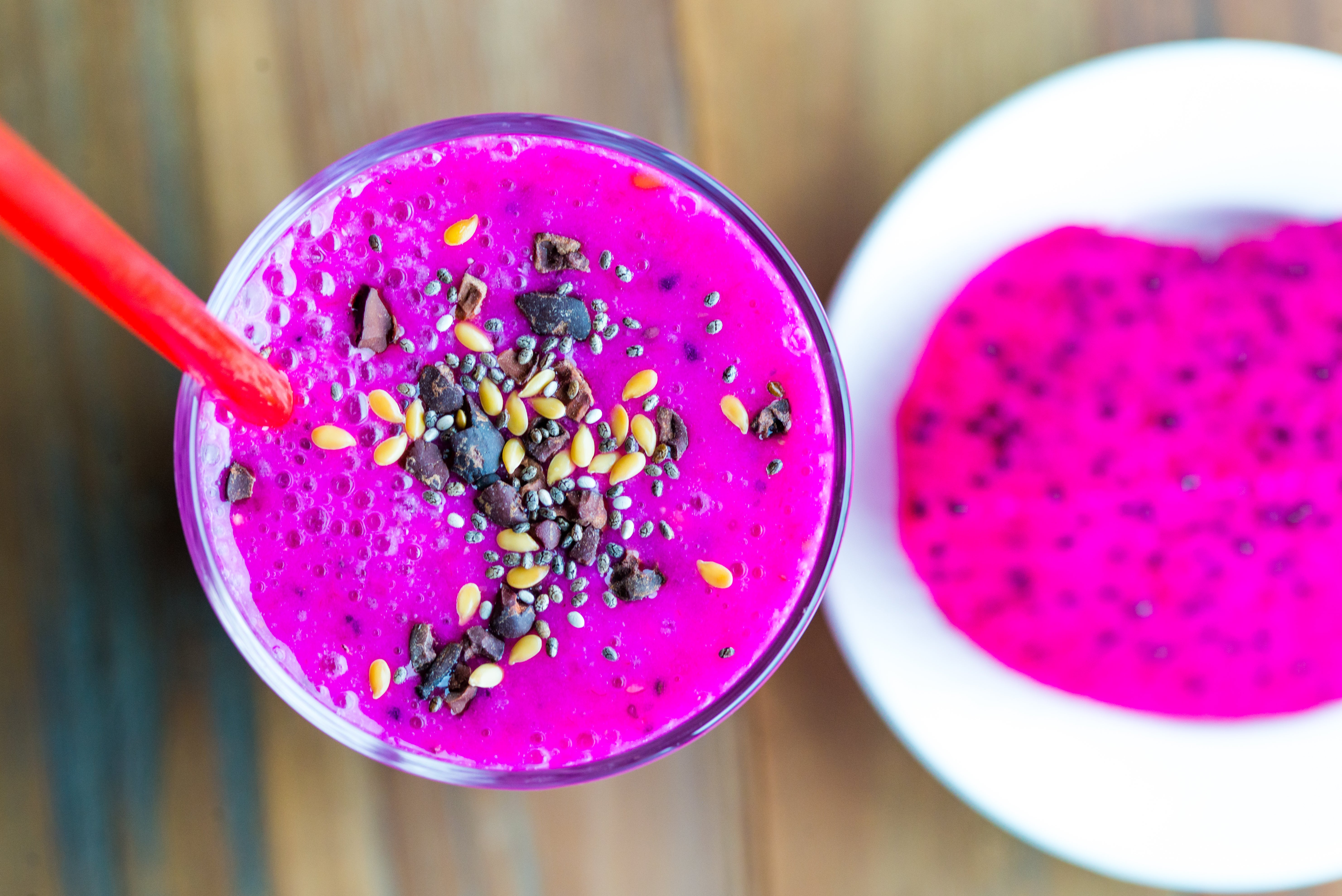 Açaí berry and red dragon fruit smoothie with chia seeds and cocoa cacao nibs