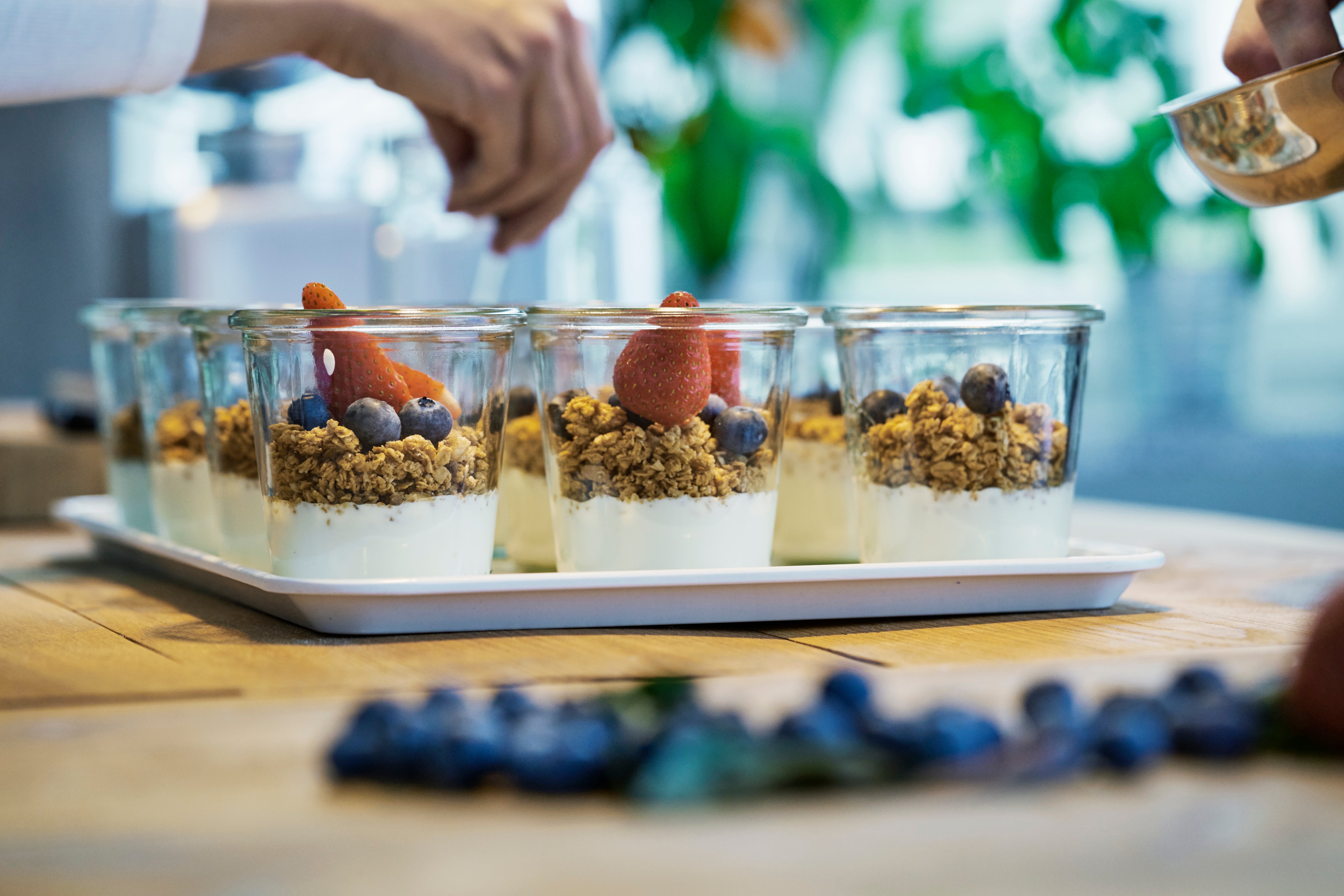 Chef preparing berry desserts, close-up