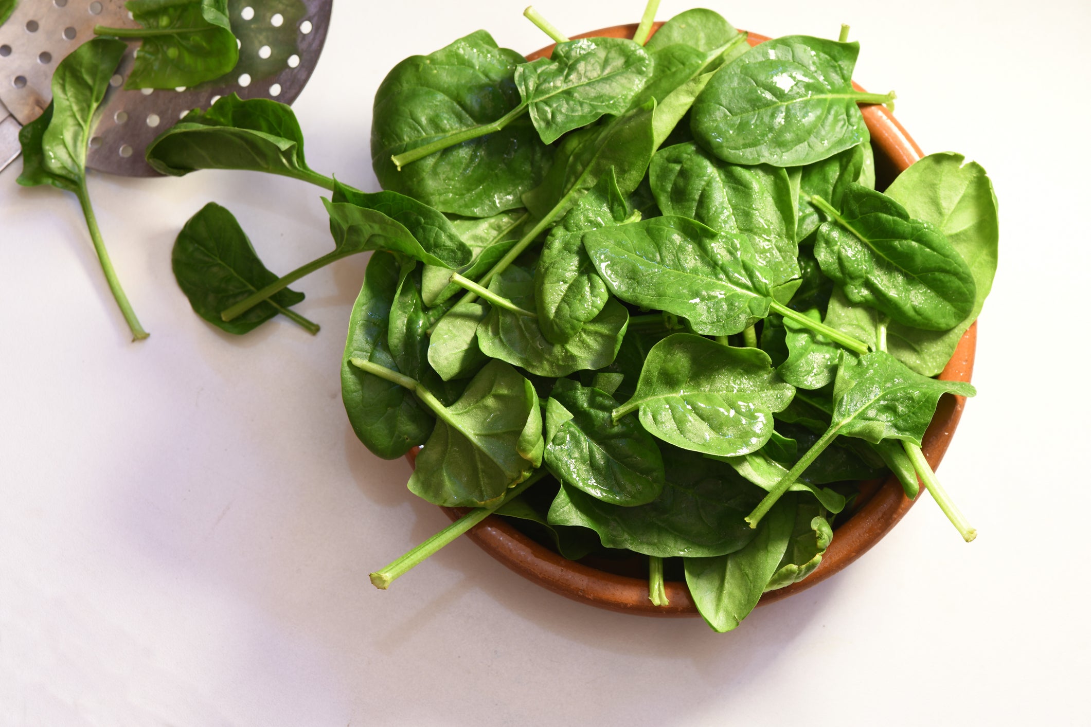 High angle view of leaf vegetable in bowl on white background,France