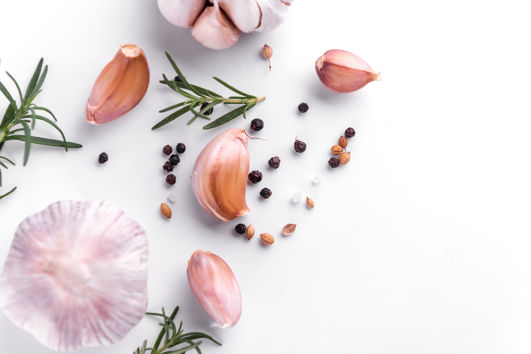 garlic and herbs on white background