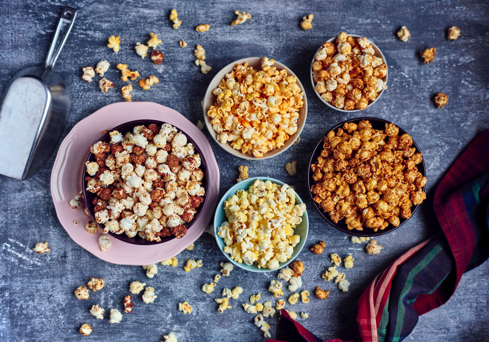 Five bows of various flavored popcorn