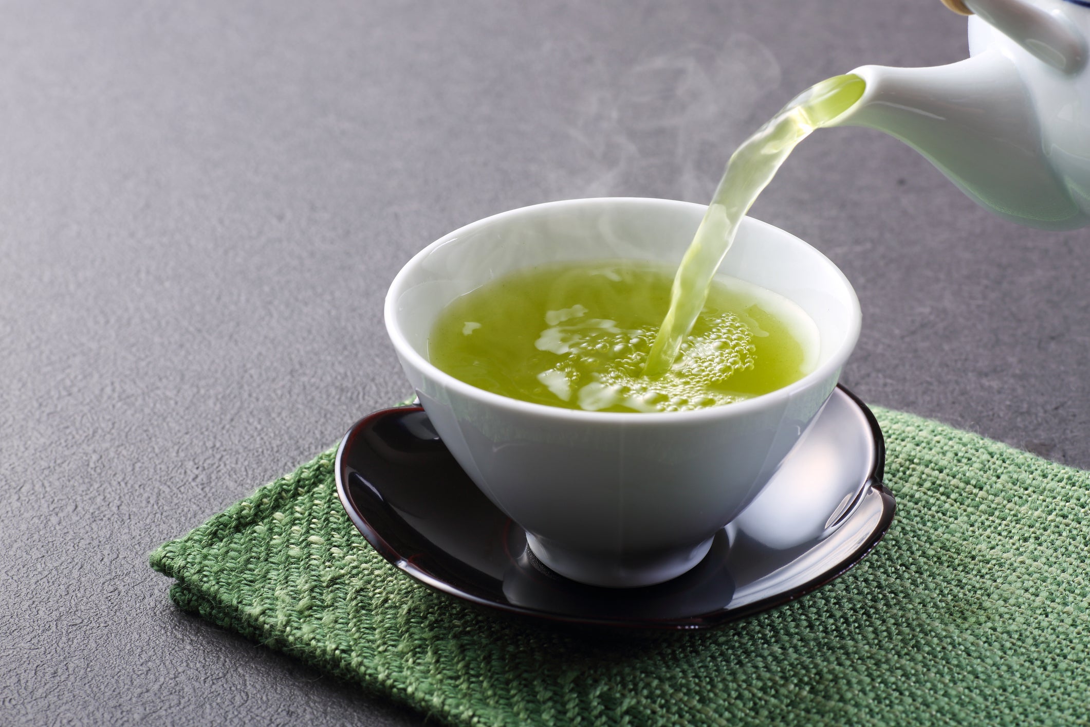 pouring green tea