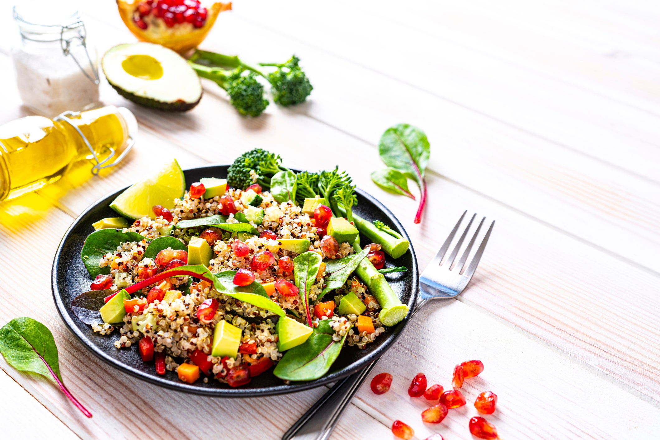 Healthy Fat Lowers Stroke Risk-Quinoa salad plate on white table. Copy space.Healthy Fat Lowers Stroke Risk-Quinoa salad plate on white table. Copy space.